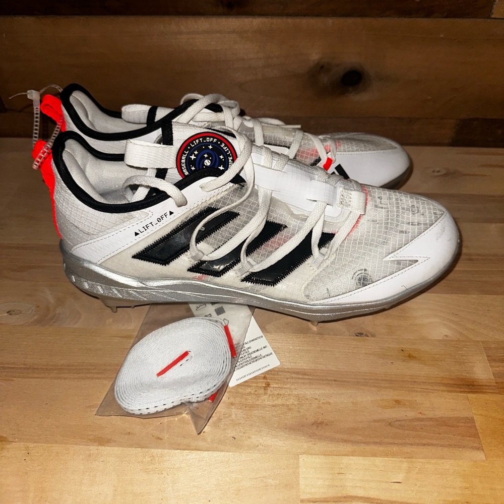 adidas White Baseball Cleats with Black Stripes and Neon Orange Pull Tabs